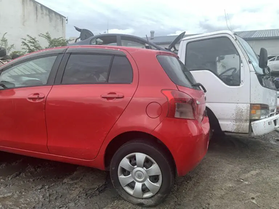 Scrap car next to Cash For Cars South Auckland tow truck
